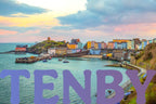 Bright seaside buildings next to the harbor in Tenby, Wales. The name of the town overlays the bottom of the image in a periwinkle/purple gradient.