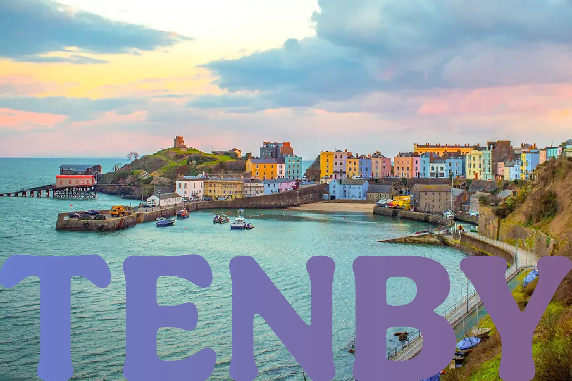 Bright seaside buildings next to the harbor in Tenby, Wales. The name of the town overlays the bottom of the image in a periwinkle/purple gradient.